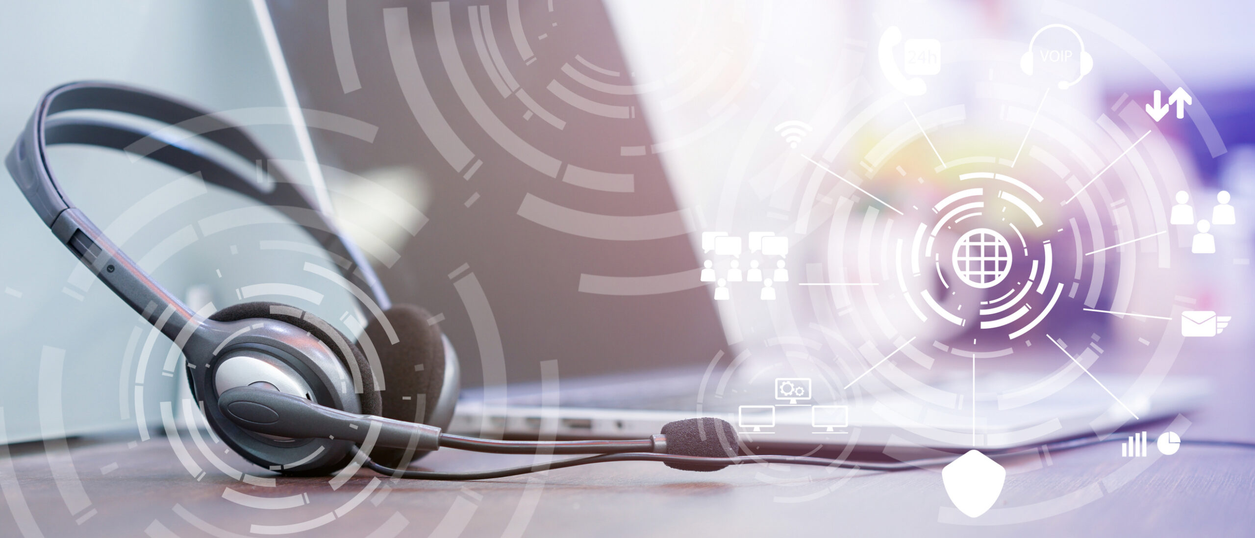close up focus on call center headset device at headset VOIP system with futuristic symbol technology at office desk for hotline telemarketing and network operation concept